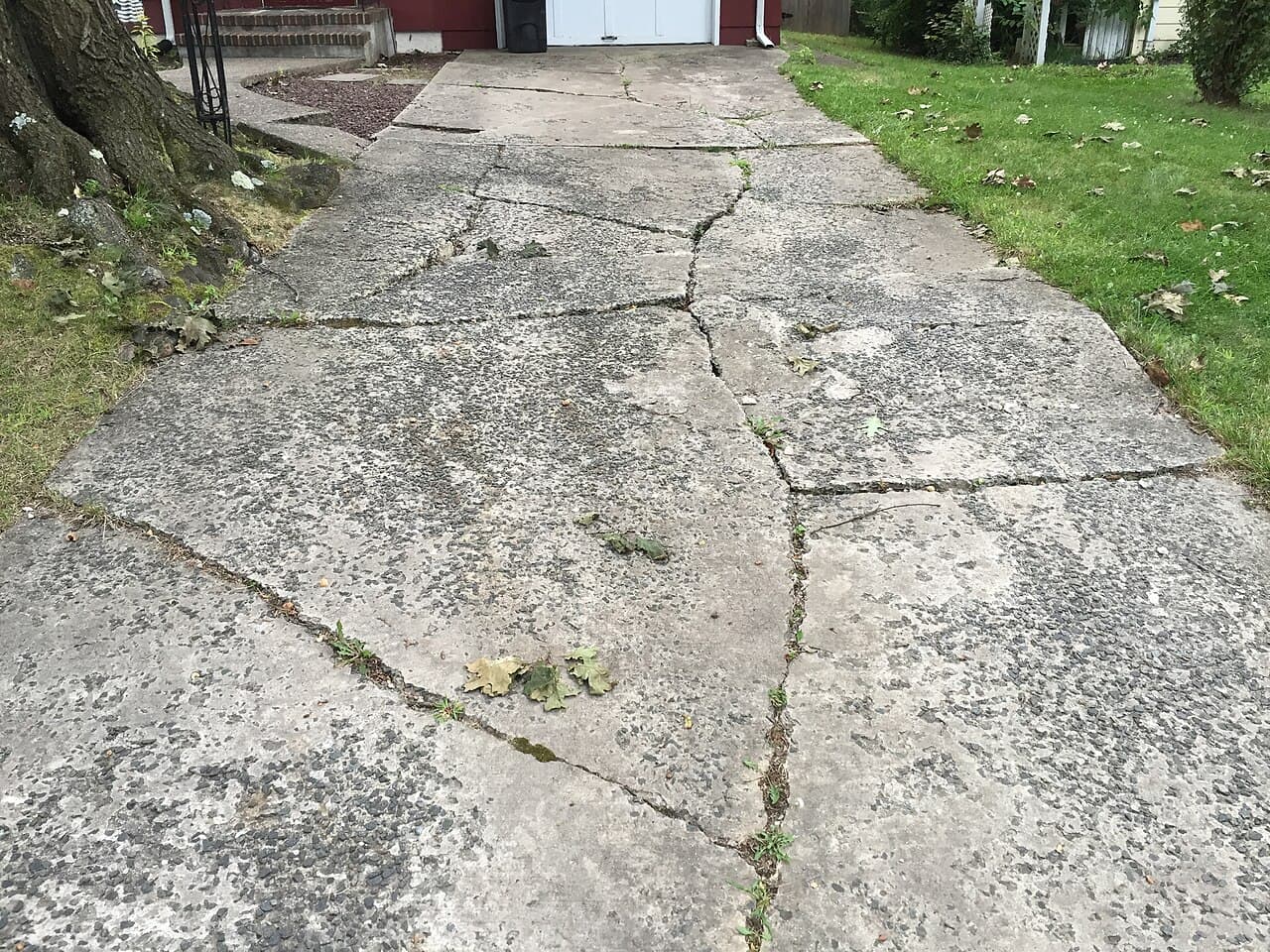 Concrete Driveway Cracking: Causes, and When to Repair vs. Replace